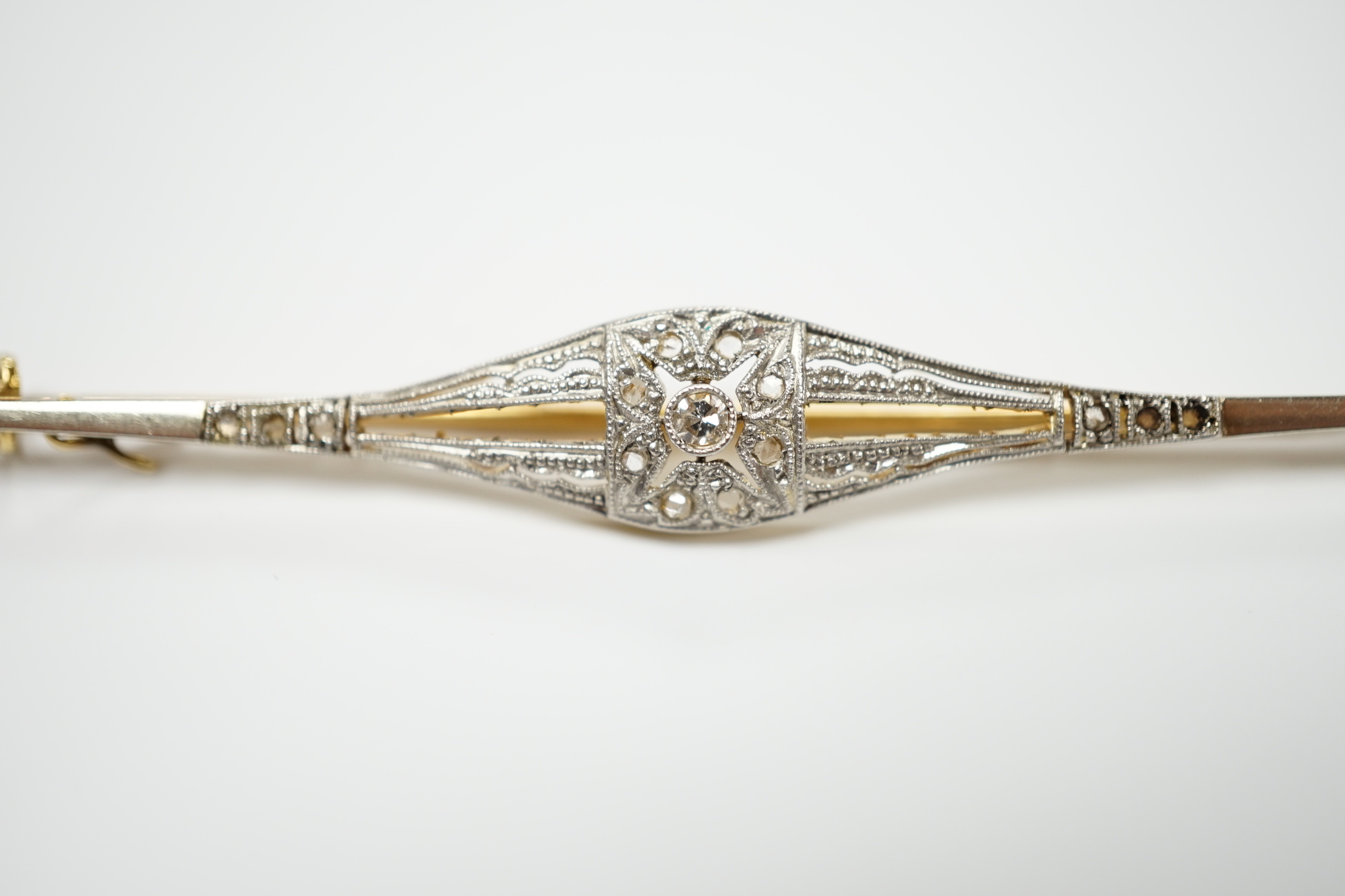 A Belle Époque yellow metal and diamond chip set bar brooch, 70mm, gross weight 3.7 grams.
